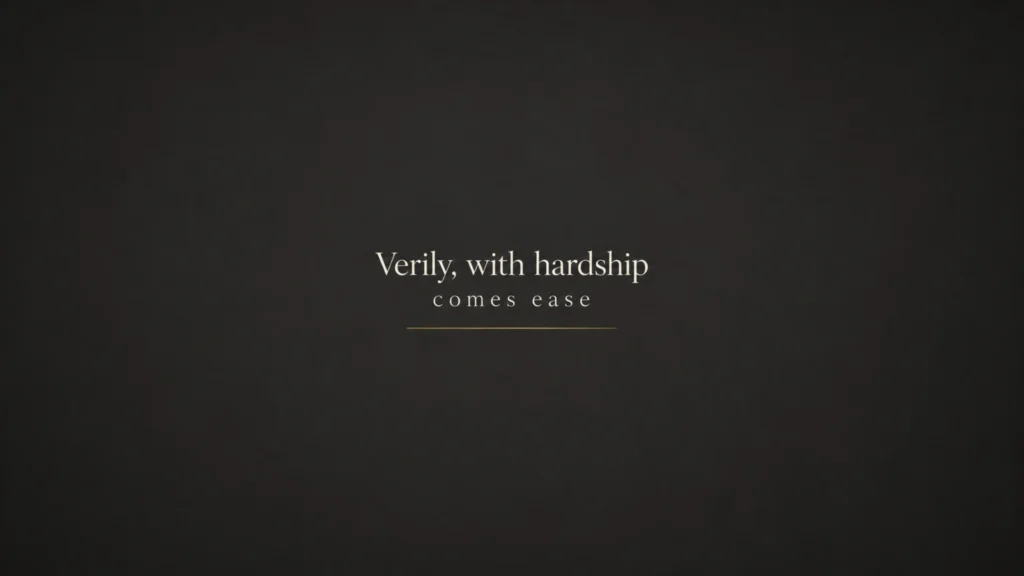 Minimalist 4K Islamic desktop wallpaper in charcoal gray with centered quote “Verily, with hardship comes ease” and a subtle gold accent line